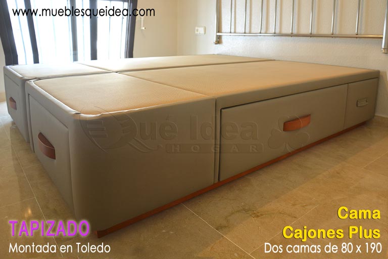 Dos camas con cajones de 80x190 para formar una sola de matrimonio tapizada en color visón montadas en Toledo