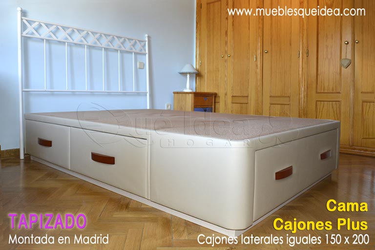 Cama con 5 cajones Plus 4 iguales en los dos laterales y uno en los pies con tiradores en cerezo y zócalo color piedra montada en Madrid