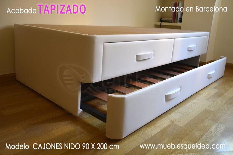 Cama supletoria con cajones arriba y nido con somier de lamas abierto debajo montada en Barcelona