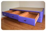 Cama supletoria con tres cajones y nido color violeta