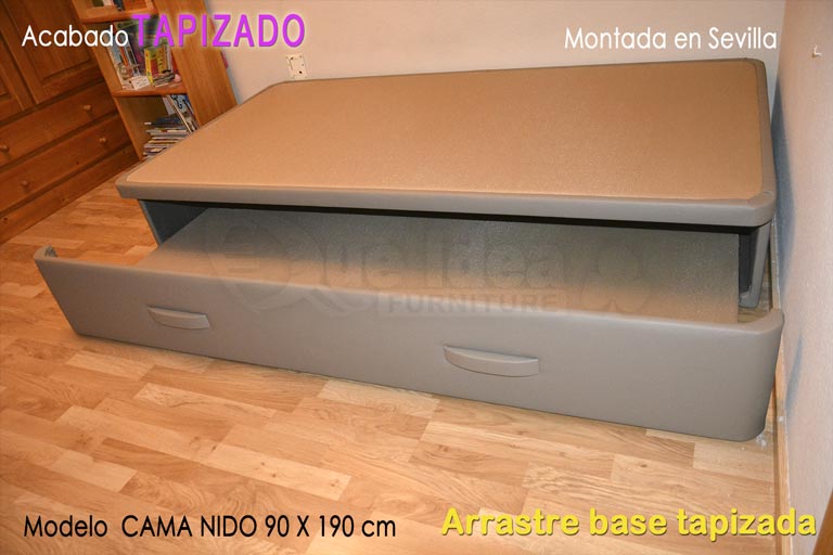 cama supletoria nido con arrastre de base tapizada montada en Sevilla de color beige