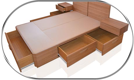 Cajones en el lateral iguales en una cama modelo Plus con cabecero y mesitas todo en uno