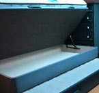 colchones y canapé nido en color gris, tapa y arrastre abiertos