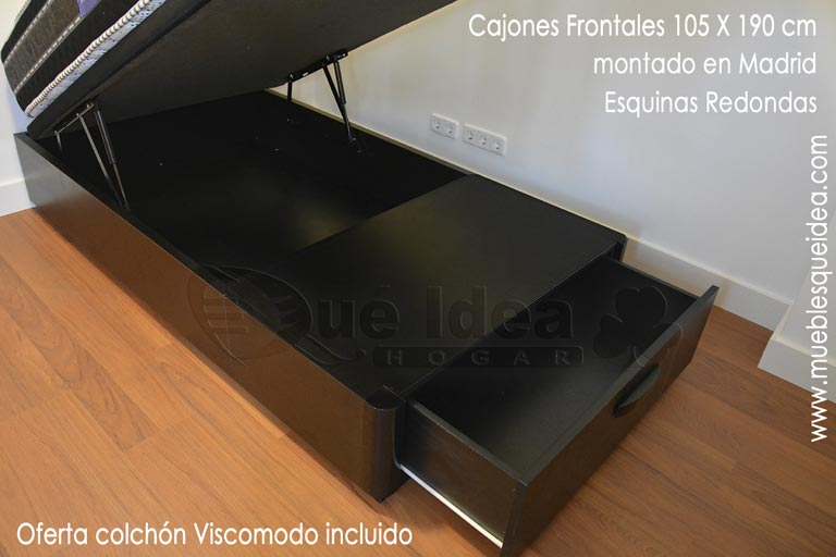 Canapé abatible de madera individual de 105x190 con pie de cama para almacenaje en un cajón todo en color negro ejemplo montado en Madrid junto con un colchón viscomodo de Qué Idea Hogar